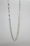 Stainless steel chain necklace with rectangular fasteners used for embossed wear.